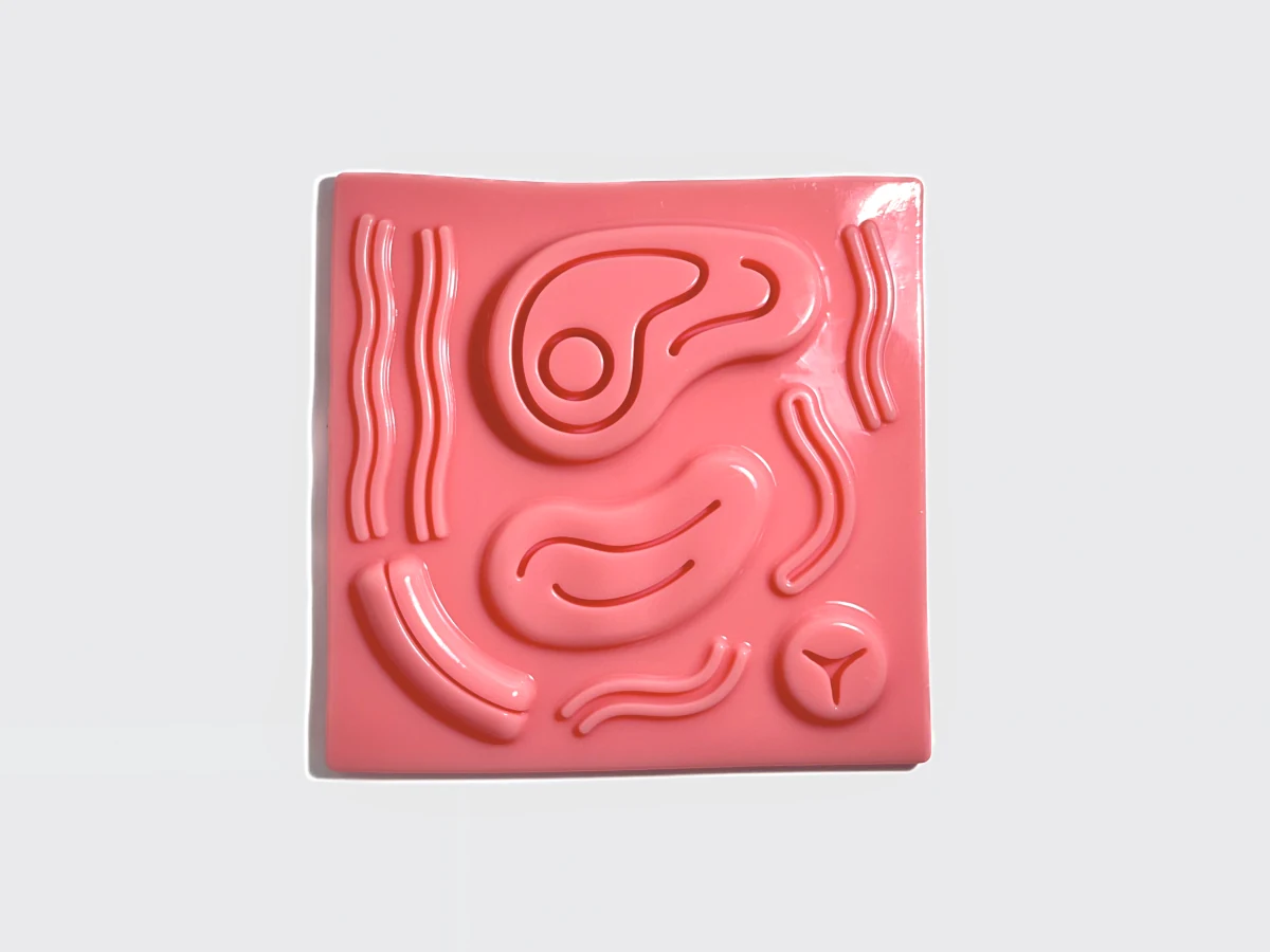 Pad de sutura dinâmico em silicone rosa, com relevos de treino na superfície